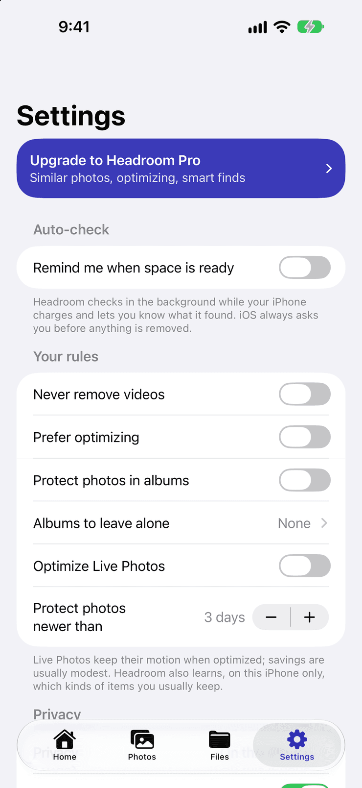 Headroom's Settings. An Upgrade to Headroom Pro banner mentions similar photos, optimizing and smart finds. An Auto-check switch, off, offers to remind you when space is ready. Under Your rules: never remove videos, prefer optimizing, protect photos in albums, albums to leave alone (None), optimize Live Photos, and protect photos newer than 3 days — with a note that Headroom learns, on this iPhone only, which kinds of items you usually keep.